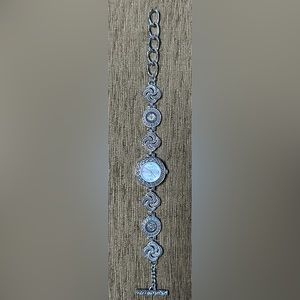 NWOT CHICO’s silver tone fancy band watch with Mother of Pearl face new battery.